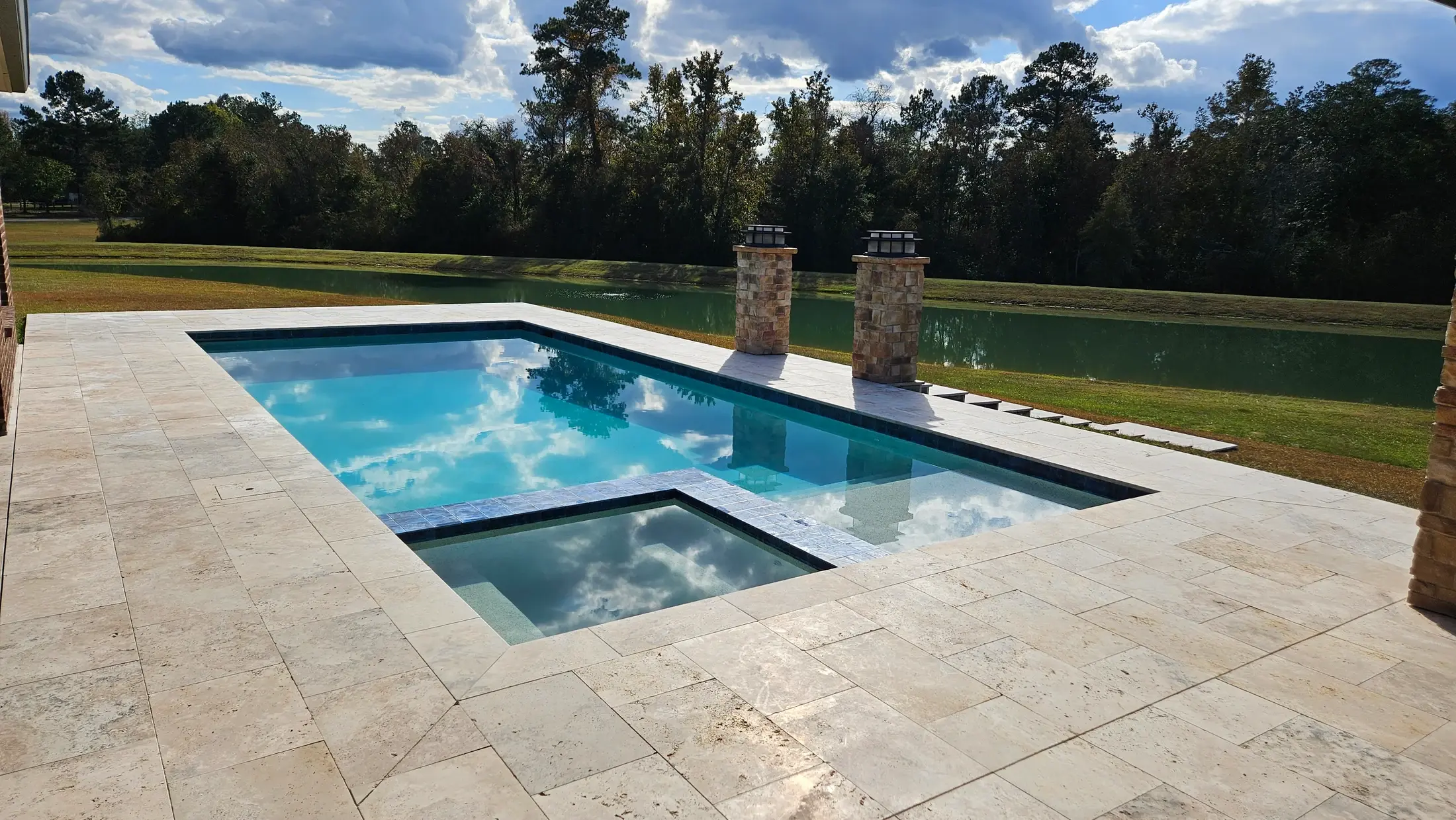 Clearwater integrated spa with carefully coordinated stone coping and pool terrace